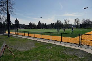 Looking at the Artificial turf field, high schoolers were using it