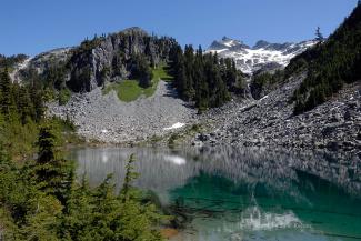 Looking across the middle lake, Tricouni peak in the distance