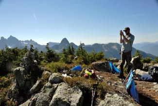 On the Summit of Anif, Geoff taking some photos