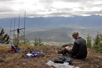 Ralph making radio contacts from Mt. Agassiz