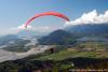 A paraglider with the Fraser & Harrison Rivers as a back drop. The image looks west down the fraser valley taken from Mount Woodside.